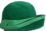 Green hat with ribbon trim detail