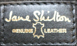 Jane Shilton black leather handbag label