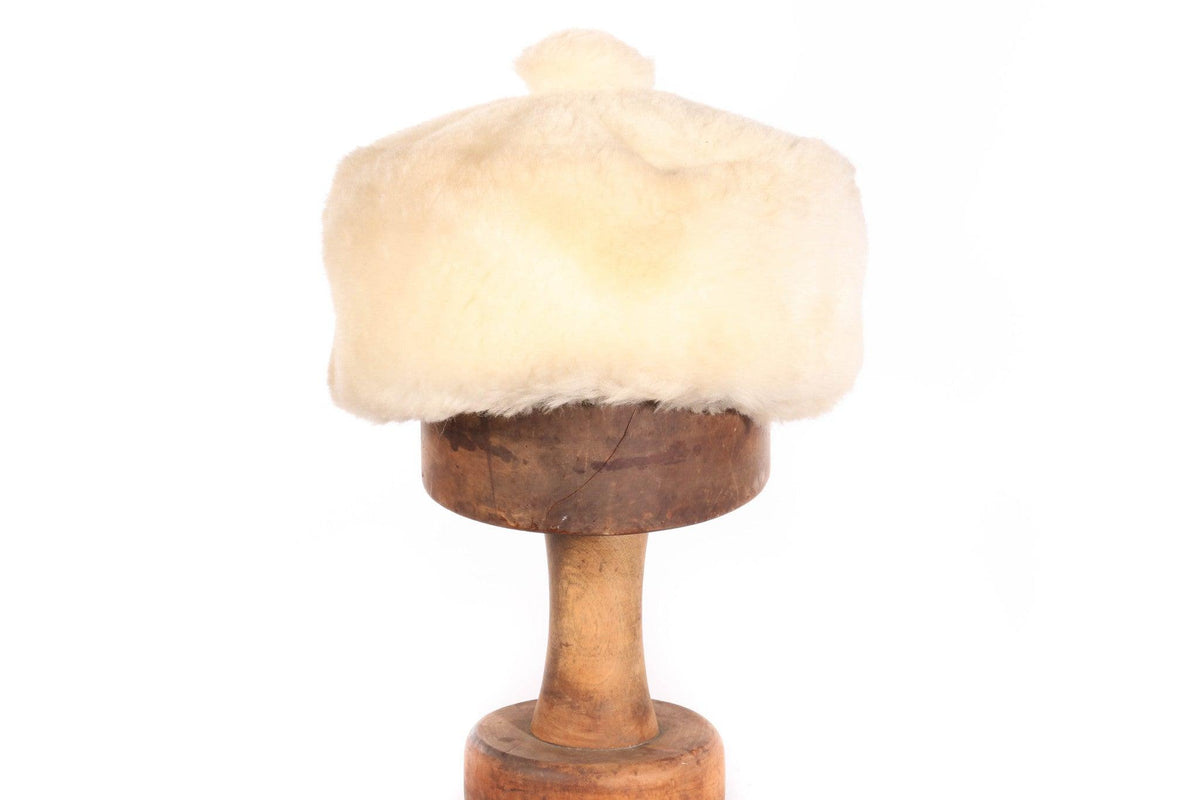 white fur hat with bobble top 