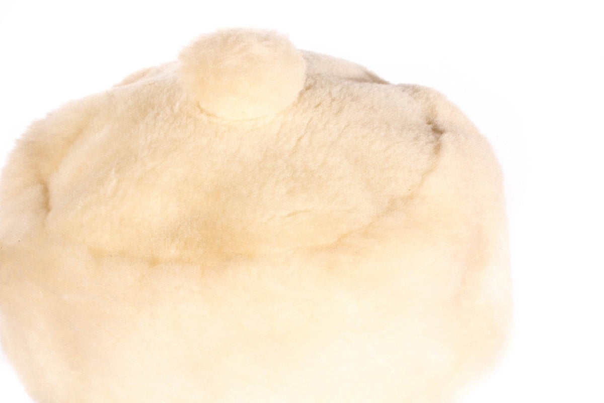 white fur hat with bobble top  detail