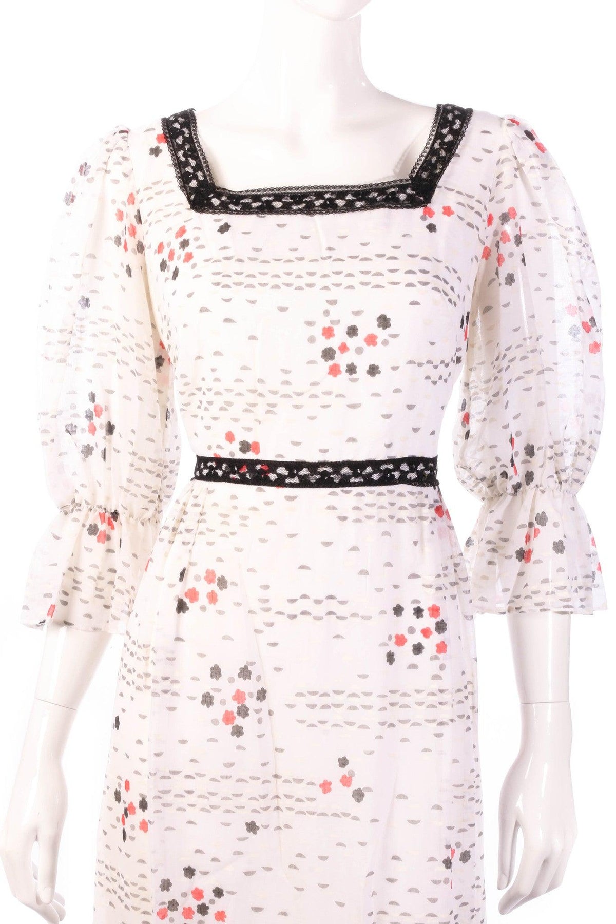 White floral dress with black lace detail detail