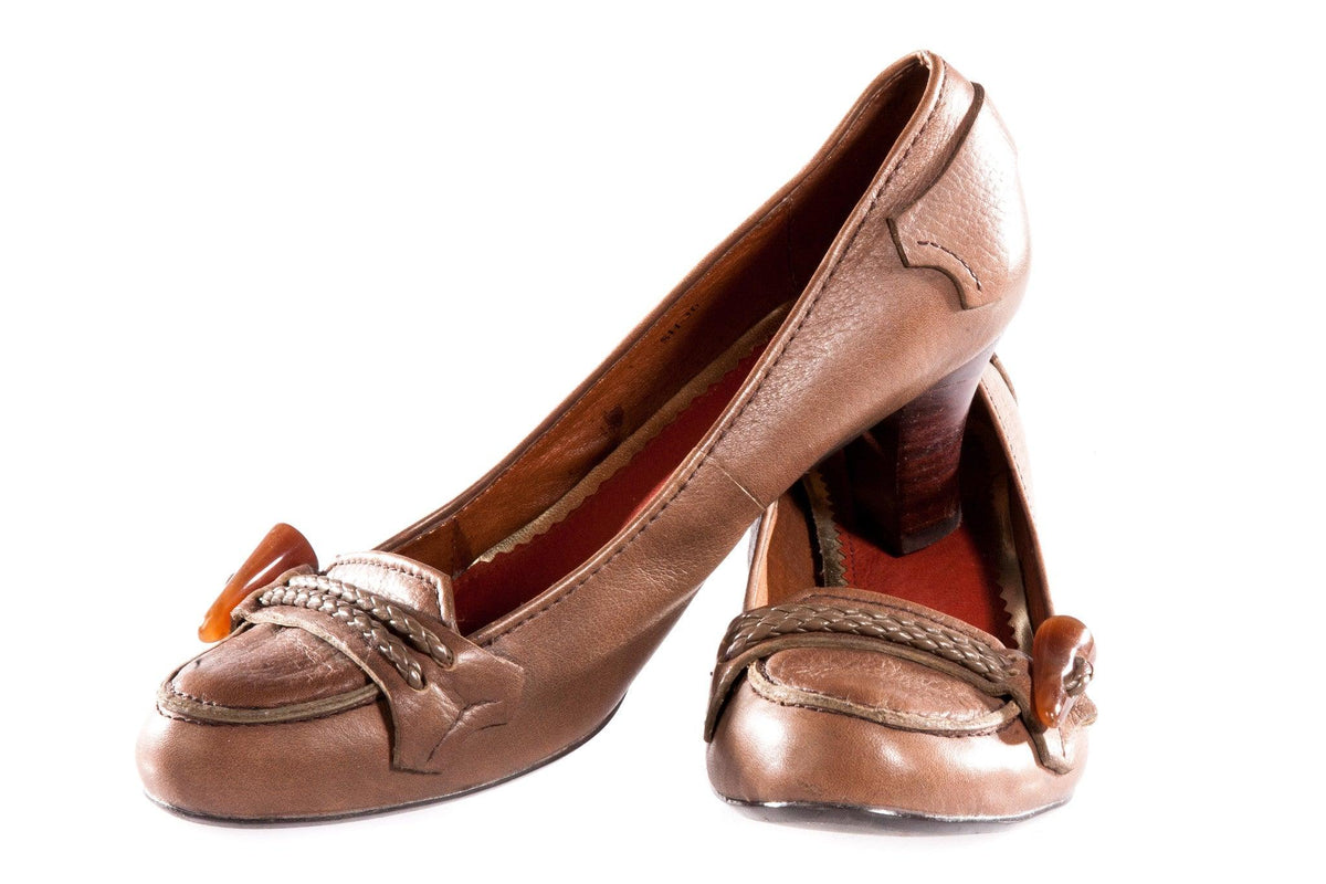 Brown leather shoes with toggle detail on the toe