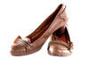 Brown leather shoes with toggle detail on the toe