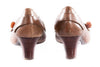 Brown leather shoes with toggle detail on the toe back