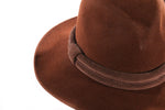 Brown suede hat with binding detail side