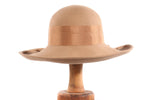 Beige hat with bow detail