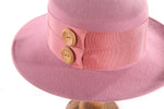 Light pink hat with button detail side